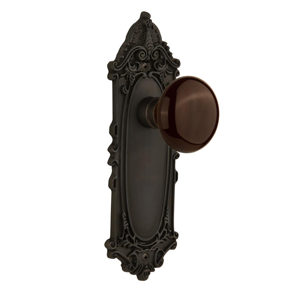 Nostalgic Warehouse VICBRN Passage Knob Victorian Plate with Brown Porcelain Knob without Keyhole in Oil Rubbed Bronze